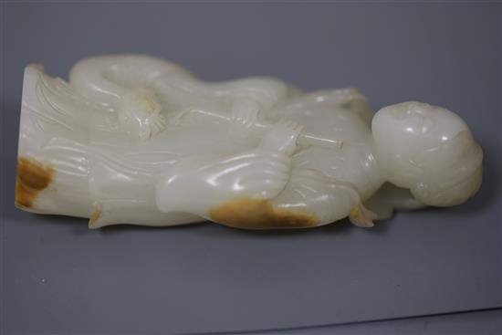 A fine Chinese white and russet jade group of Xi Wangmu and a phoenix, 19th/20th century, 9.5cm high, wood stand